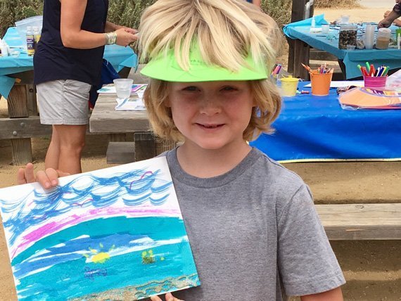 Child Showing Off Art Created with Jumbo Spring Break Art Box